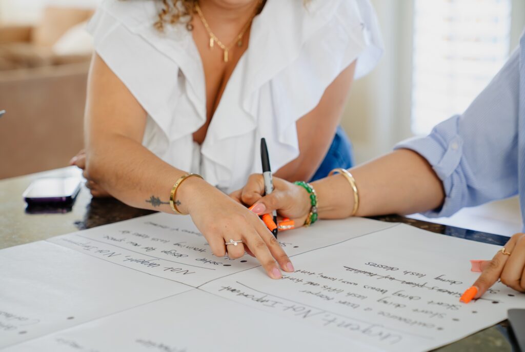 women writing on paper
